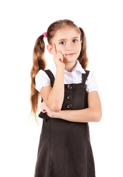 Schönes kleines Mädchen in Schuluniform isoliert auf weiß — Stockfoto