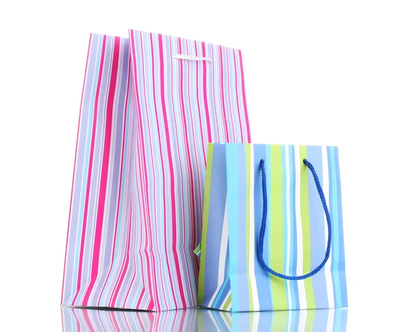 Světlé dárkové tašky izolované na bílém — Stock fotografie