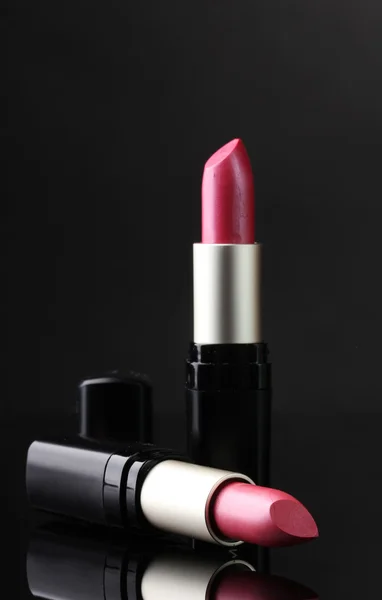 Two lipsticks isolated on black — Stock Photo, Image