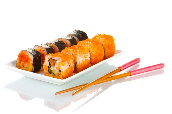 Köstliches Sushi auf Teller und Stäbchen isoliert auf weiß — Stockfoto