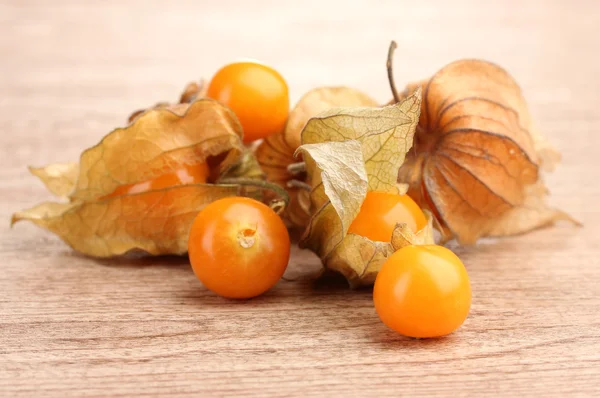 Physalis heap on wooden background — Stock Photo, Image