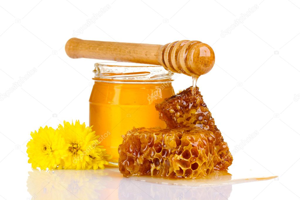 Jar of honey, honeycombs and wooden drizzler isolated on white