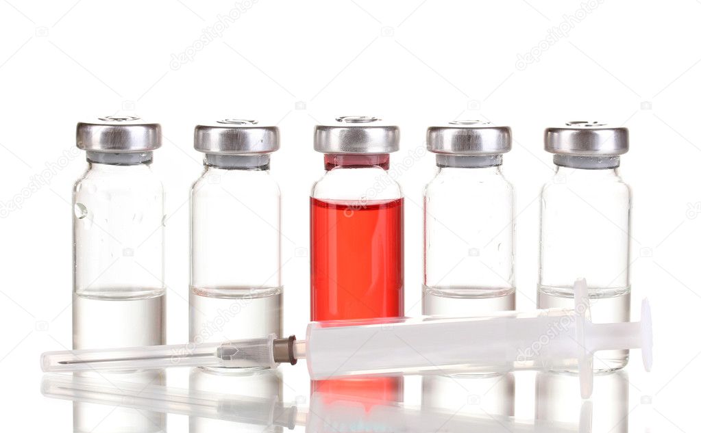 Syringe and medical ampoules isolated on white