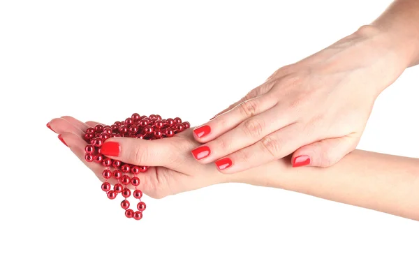 Mãos femininas com manicure e contas vermelhas isoladas em branco — Fotografia de Stock