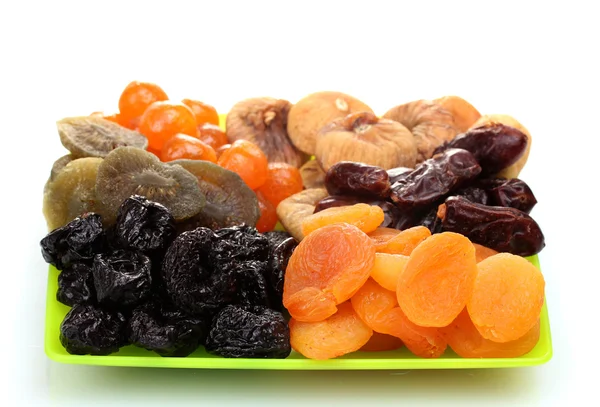 Delicious dried fruits on plate isolated on white — Stock Photo, Image