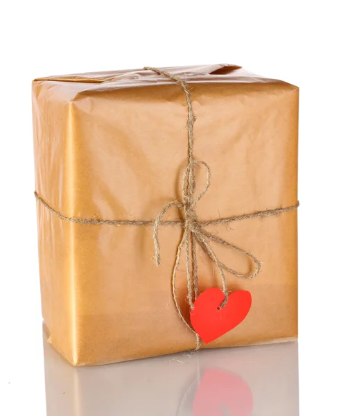 Parcel with blank heart-shaped label isolated on white Stock Photo