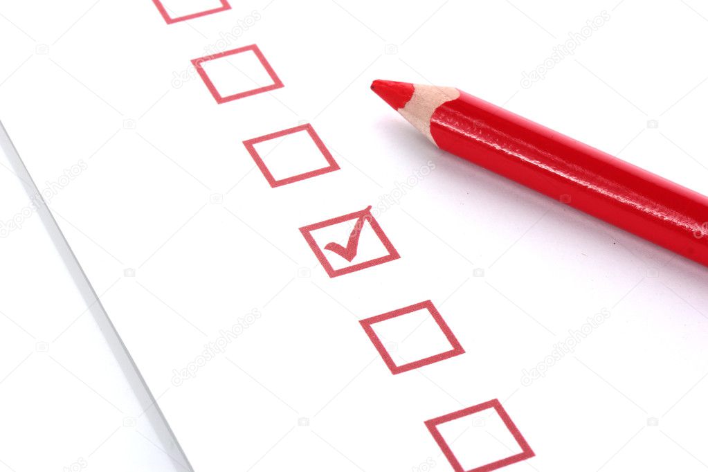 Checklist and red pencil closeup
