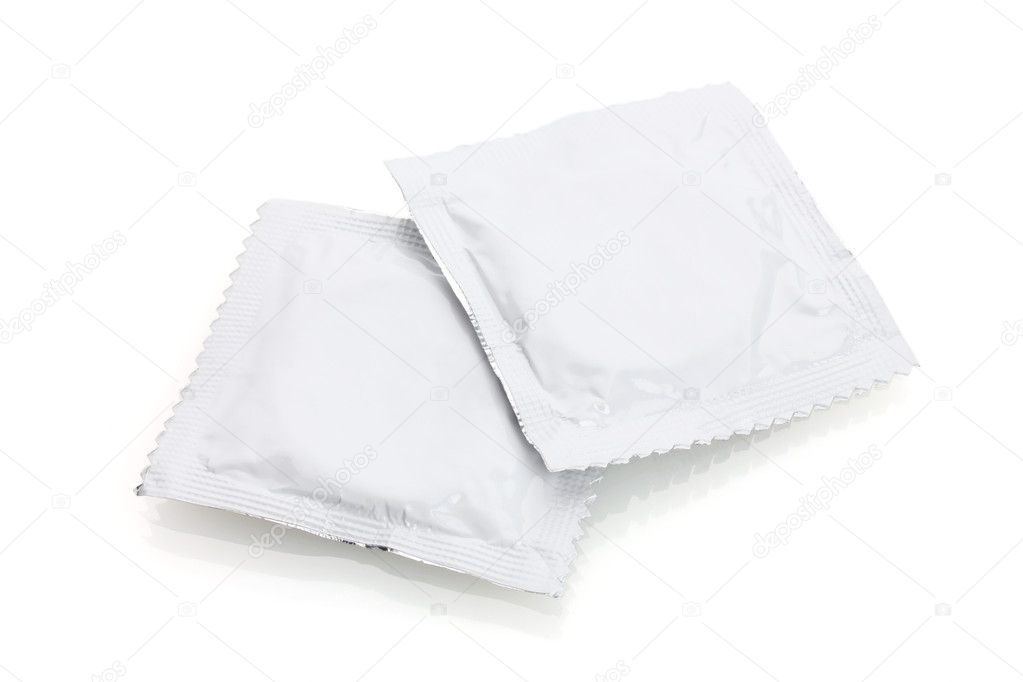 Two condoms isolated on white