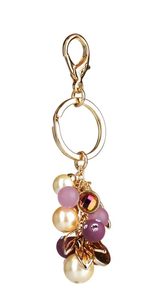 Beautiful golden keychain with precious stones isolated on white — Stock Photo, Image