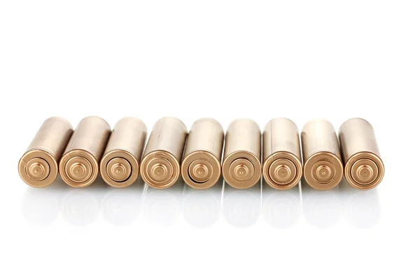 Goldene Batterien isoliert auf weiß — Stockfoto