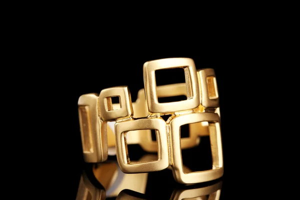 Beautiful gold ring on black background — Stock Photo, Image