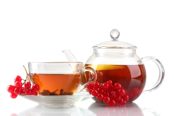 Herbaty czarne owoce egzotyczne w szklany czajnik i filiżanki na zielonym tle — Zdjęcie stockowe
