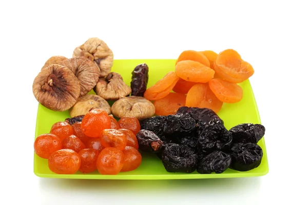 Deliciosos frutos secos en plato aislado en blanco —  Fotos de Stock