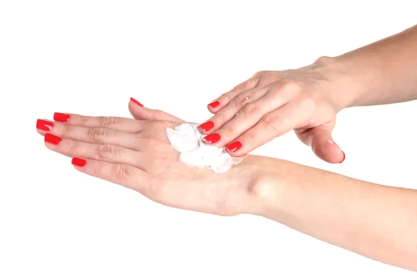 Vrouwelijke hand met manicure crème aan kant toe te passen op wit wordt geïsoleerd — Stockfoto