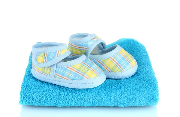 Blue baby booties on blue towel isolated on white — Stock Photo, Image