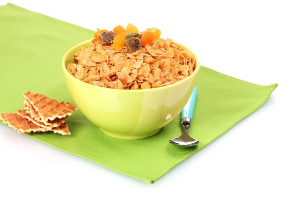 Välsmakande cornflakes i skål med torkade frukter på gröna servett — Stockfoto