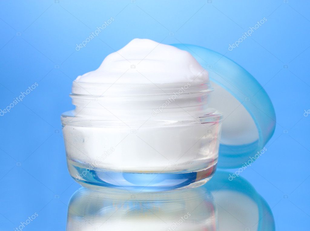 Cosmetic cream on blue background