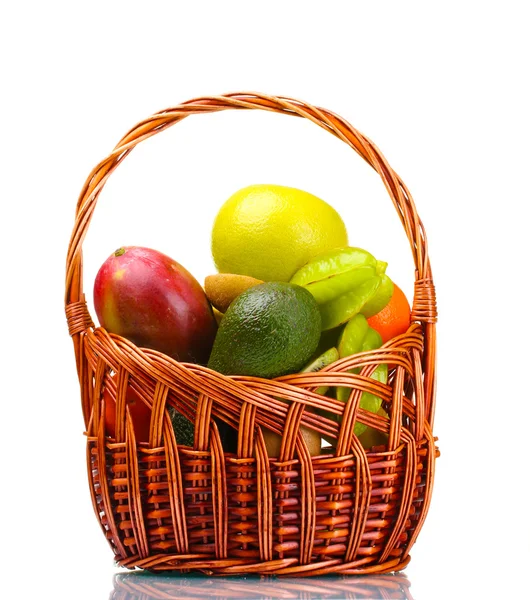 stock image Assortment of exotic fruits in basket isolated on white