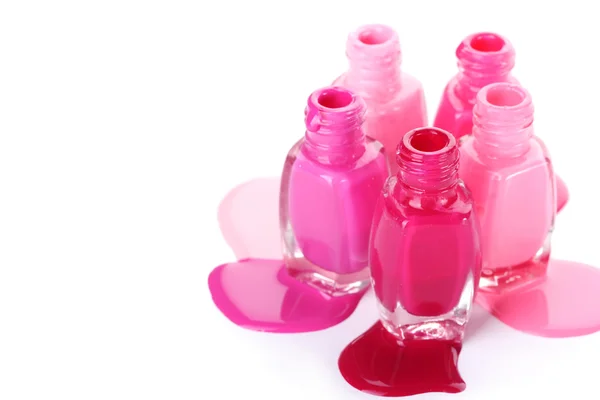 Botellas abiertas con esmalte de uñas brillante aislado en blanco — Foto de Stock