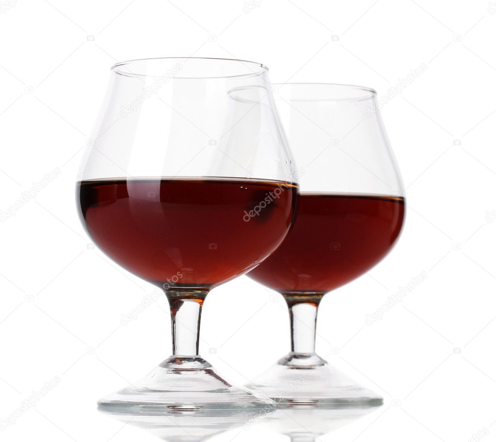 Glasses of brandy isolated on white