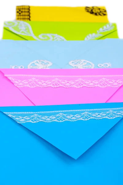 Bunch of color envelopes close-up isolated on white — Stock Photo, Image