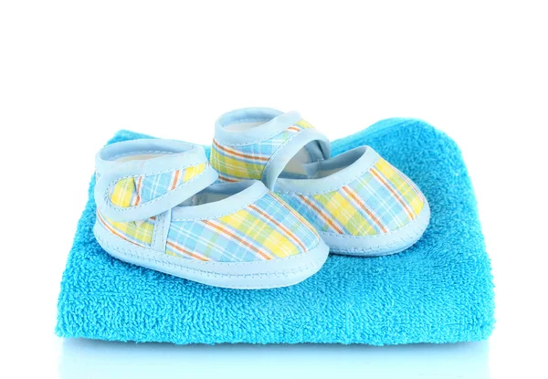 Blue baby booties on blue towel isolated on white — Stock Photo, Image