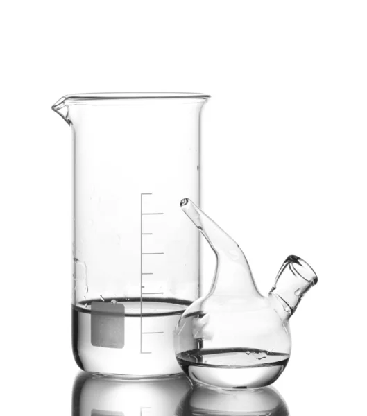 Measuring beaker and Schuster's dropper with water and reflection isol — Stock Photo, Image