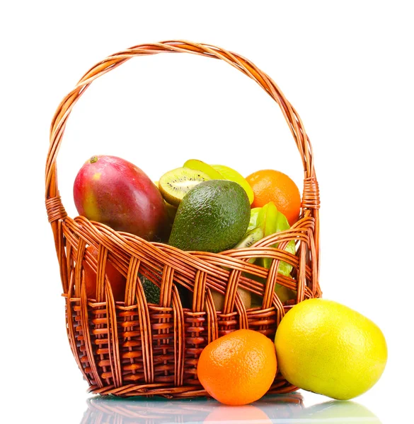 stock image Assortment of exotic fruits in basket isolated on white