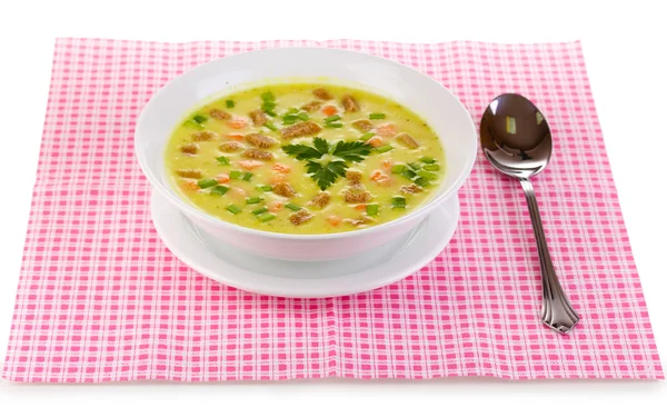 Tasty soup on pink napkin isolated on white — Stock Photo, Image