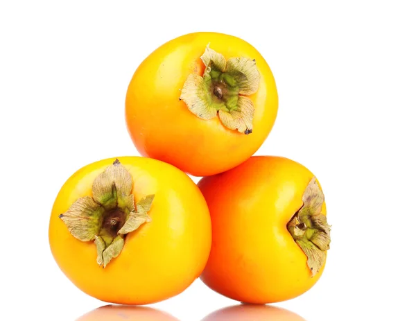 Trzy apetyczny persimmons na białym tle — Zdjęcie stockowe