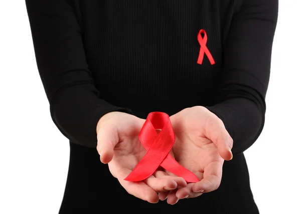 Vrouw met aids bewustzijn rood lint in handen geïsoleerd op wit — Stockfoto