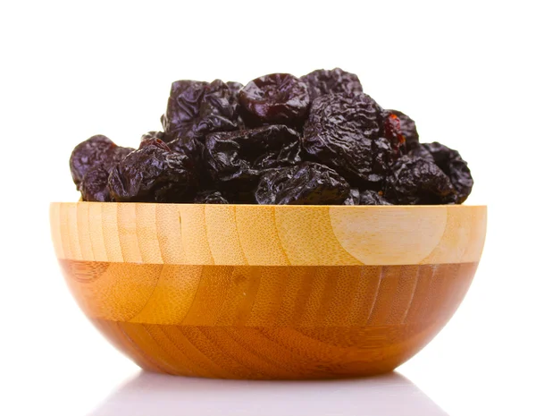 Yummy dried plums in wooden bowl isolated on white — Stock Photo, Image