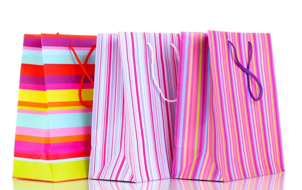 Bolsas de regalo coloridas aisladas en blanco — Foto de Stock