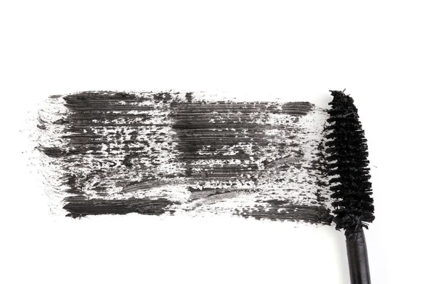 Zwarte mascara borstel beroerte close-up geïsoleerd op wit — Stockfoto
