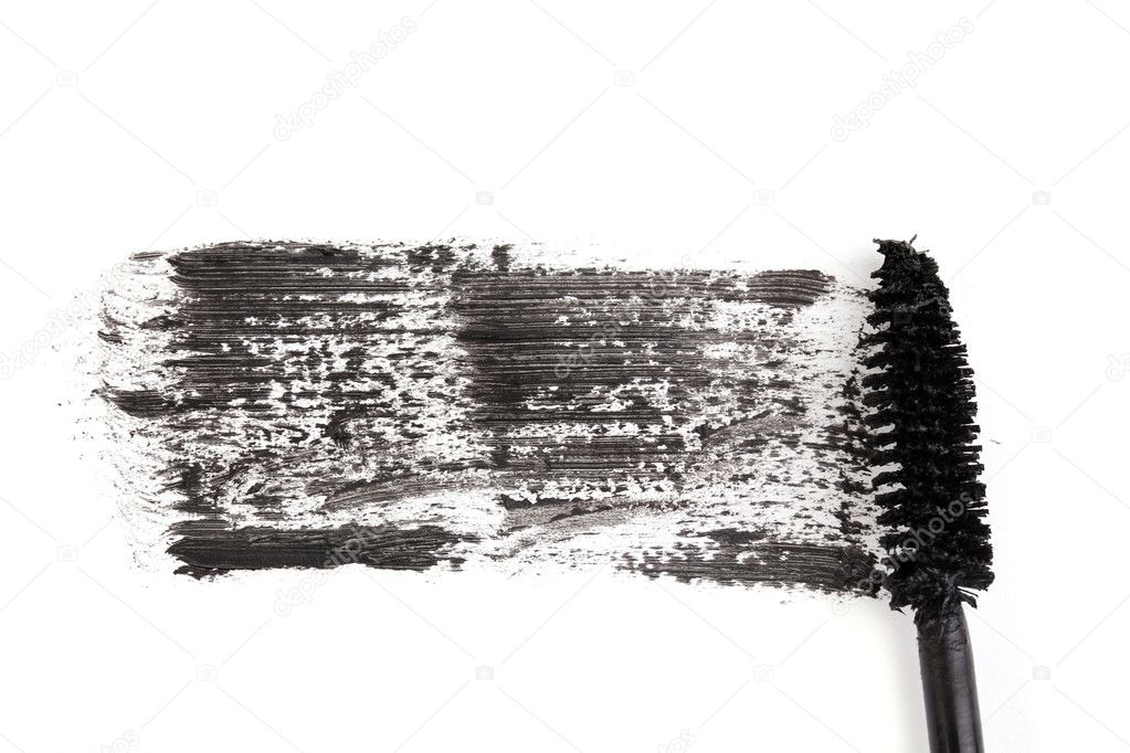 Black mascara brush stroke close-up isolated on white