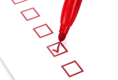Checklist and red marker closeup clipart