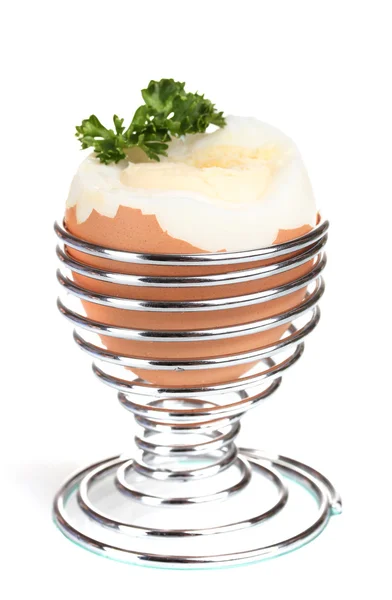 Boiled egg in metal stand and parsley isolated on white — Stock Photo, Image