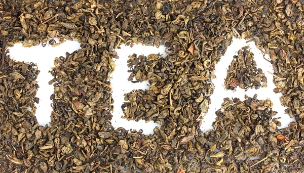 Palabra de té hecha de hojas secas primer plano — Foto de Stock