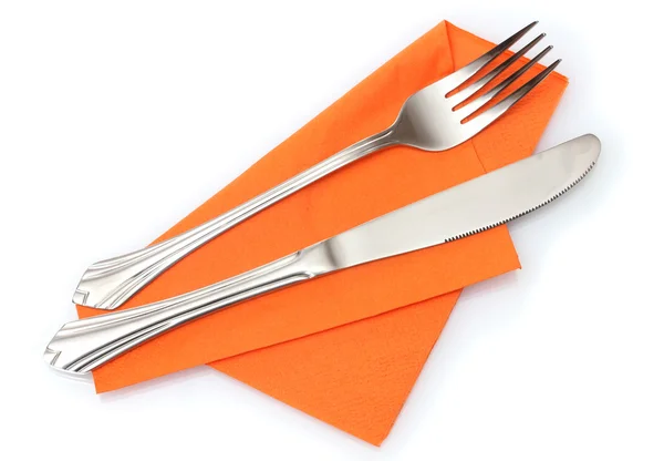 Forchetta e coltello in un panno arancione isolato su bianco — Foto Stock
