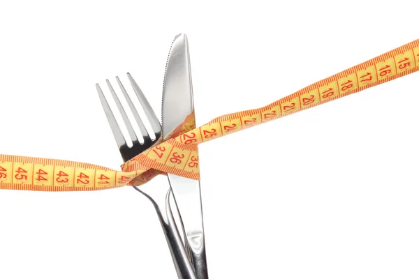 Fork, knife and measuring tape isolated on white — Stock Photo, Image