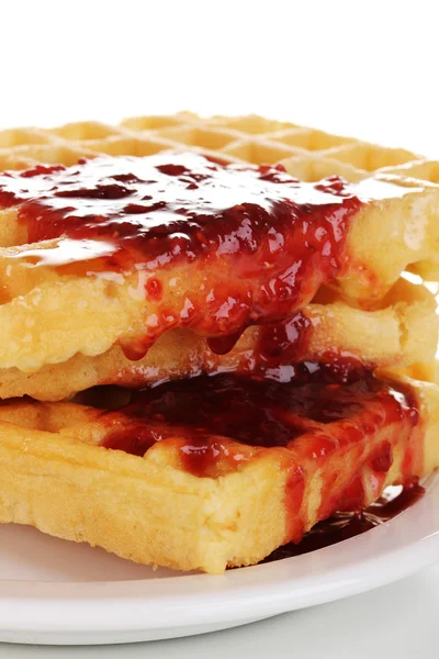 Tasty waffles with jam on plate close-up isolated on white — Stock Photo, Image