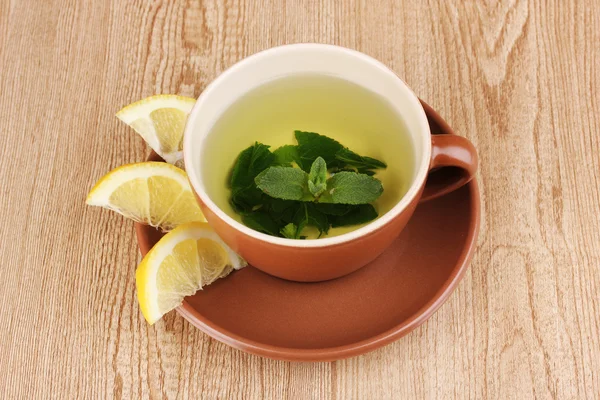 stock image Mint tea with mint leaf and lemon on wooden background