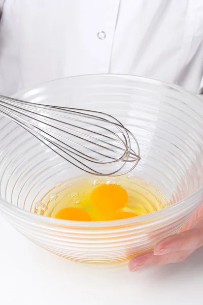 Female hands Mixing eggs in bowl close up — Stock Photo, Image