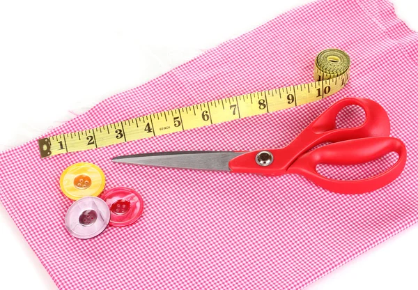 Scissors and measuring tape on fabric isolated on white — Stock Photo, Image