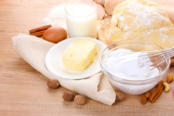 stock image Ingredients for the dough wooden table