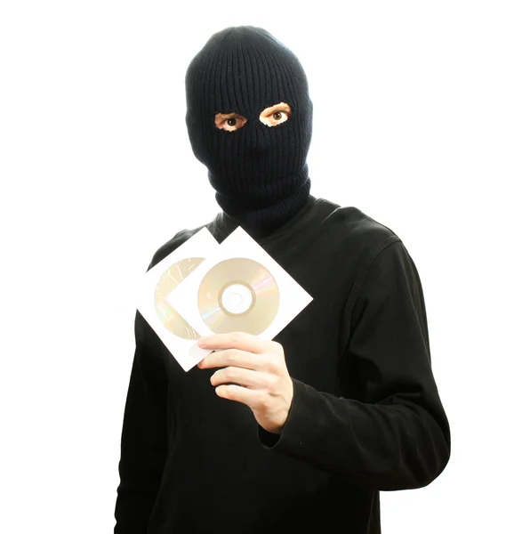 Bandido em máscara preta com discos de CD isolados em branco — Fotografia de Stock