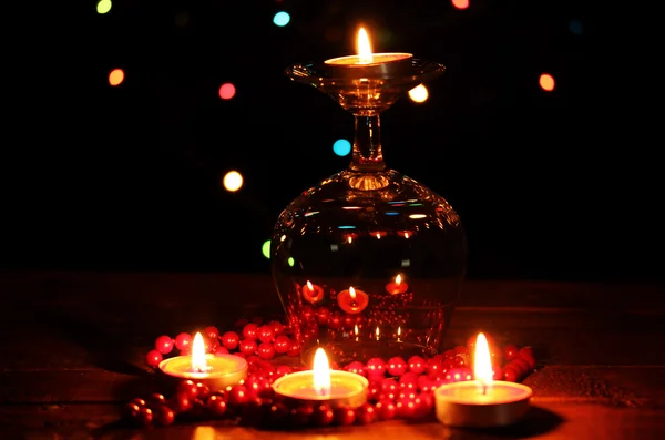 Amazing composition of candles on wooden table on bright background — Stock Photo, Image