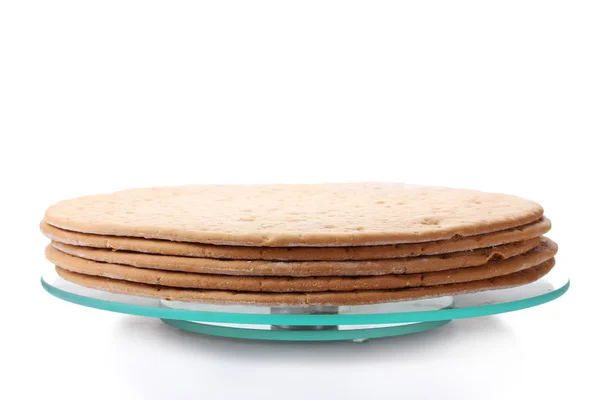 Torte per torta su supporto di vetro isolato su bianco — Foto Stock