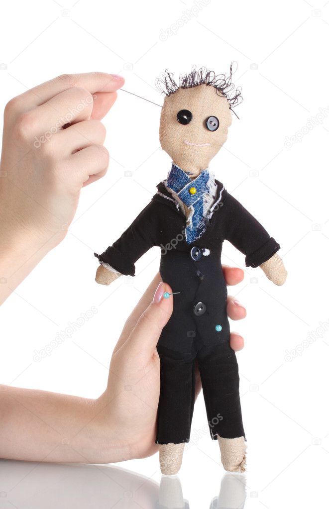 Voodoo doll boy-groom in the hands of women isolated on white