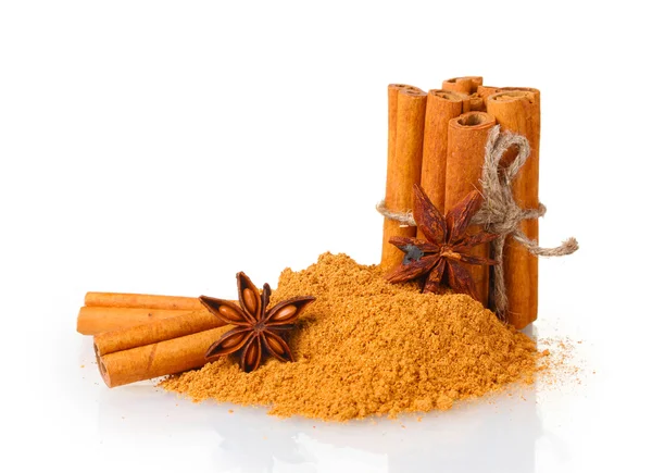 Cinnamon sticks, powder and anise isolated on white — Stock Photo, Image